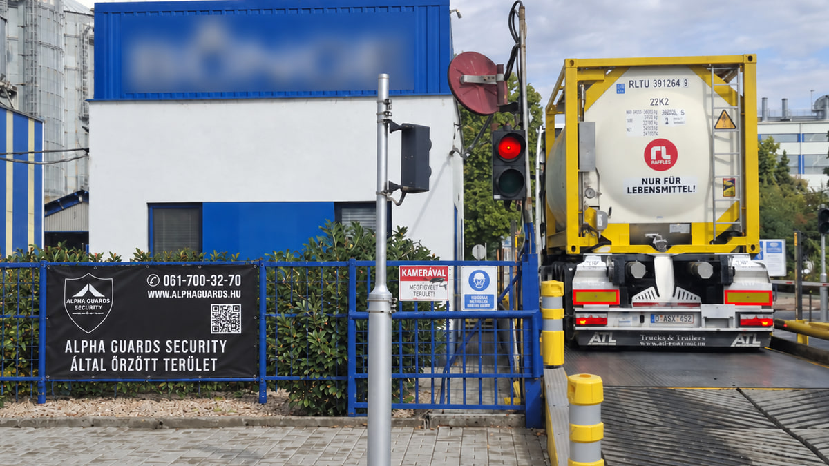 Industrial site entrance with a traffic light and access equipment